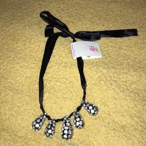 Women’s tie teardrop necklace.